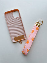 Load image into Gallery viewer, Phone Wrist Strap - pink & orange smileys
