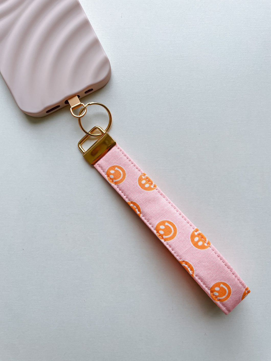 Phone Wrist Strap - pink & orange smileys