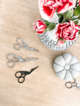 Load image into Gallery viewer, Black and silver stork embroidery scissors, pin cushion and flowers
